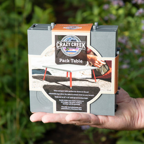 Folded table in hand with packaging