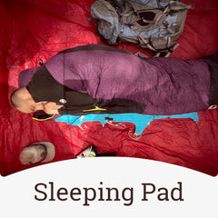 A man using the air chair as a sleeping pad