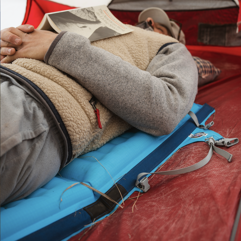 Load image into Gallery viewer, Man laying down on the AirCliner using it as a sleeping pad in a tent
