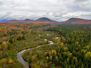 Northern Forest Canoe Trail - Winding river through green and golden trees