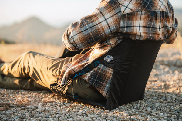 Reclining in a Crazy Creek chair in a desert