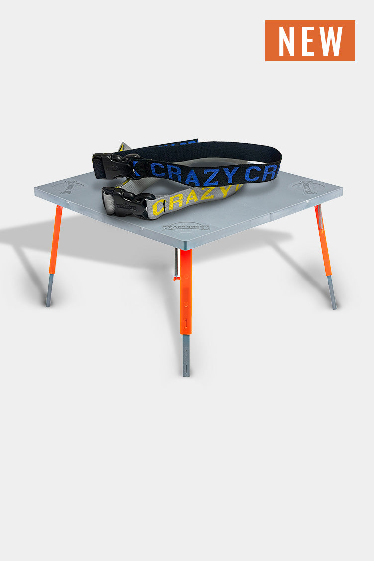 Crazy Creek Chair and straps on white background