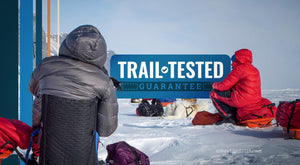 Trail Tested Guarantee - A woman sitting in a crazy creek chair at basecamp in the icy plains