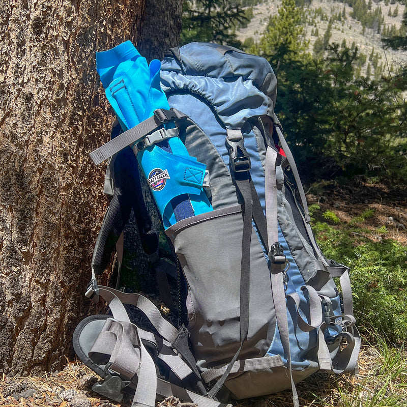 Load image into Gallery viewer, AirCliner chair rolled up and stored in the side pocket of a backpack
