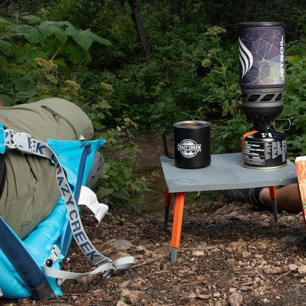 The perfect pairing to the Crazy Creek chair is the Camp Table - Low to the ground