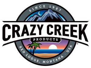 Crazy Creek Products logo featuring a mountain and beach-themed design, representing outdoor adventure and comfort.