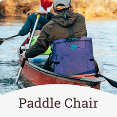 Crazy Creek chair being used as a paddle chair in a canoe