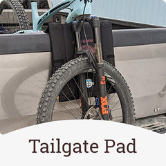 Crazy Creek chair being used as a tailgate pad for a mountain bike