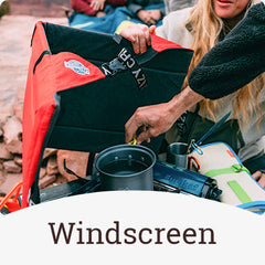 Crazy Creek chair being used as a windscreen for a portable camp stove